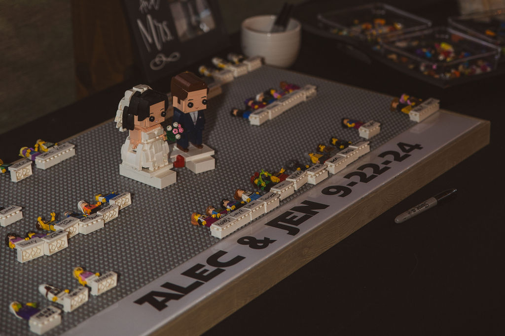 LEGO BrickHeadz guest book labeled Alec & Jen 9-22-24 sits ready for Jen & Alec at Covey Creek