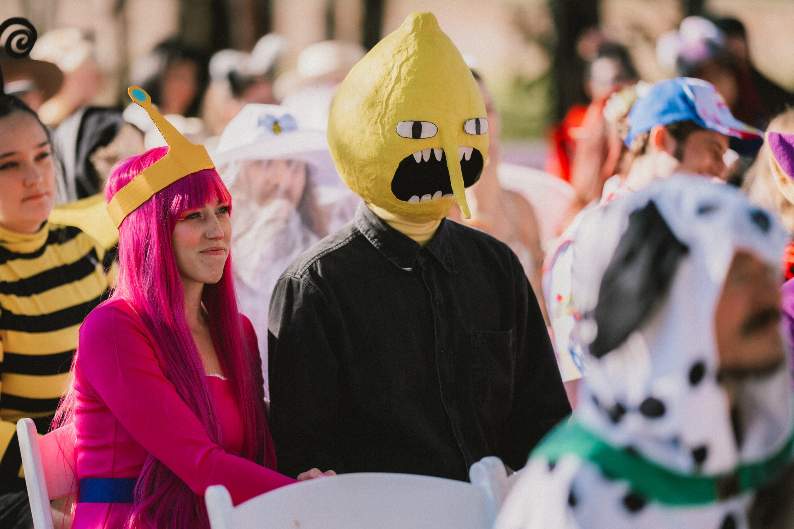 Guests as Princess Bubblegum and Lemongrab sit for Erin & Baxter's outdoor ceremony at Covey Creek