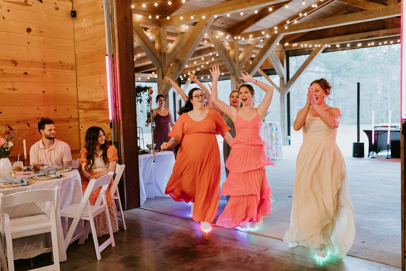 Leslie & Timothy bridal party enters Covey Creek reception dancing in glowing LED sneakers