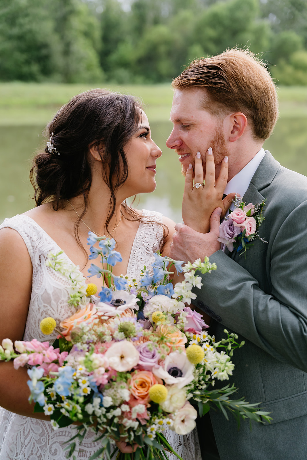 Meredith & Benjamin share a close portrait by the Pond with her wildflower bouquet at Covey Creek
