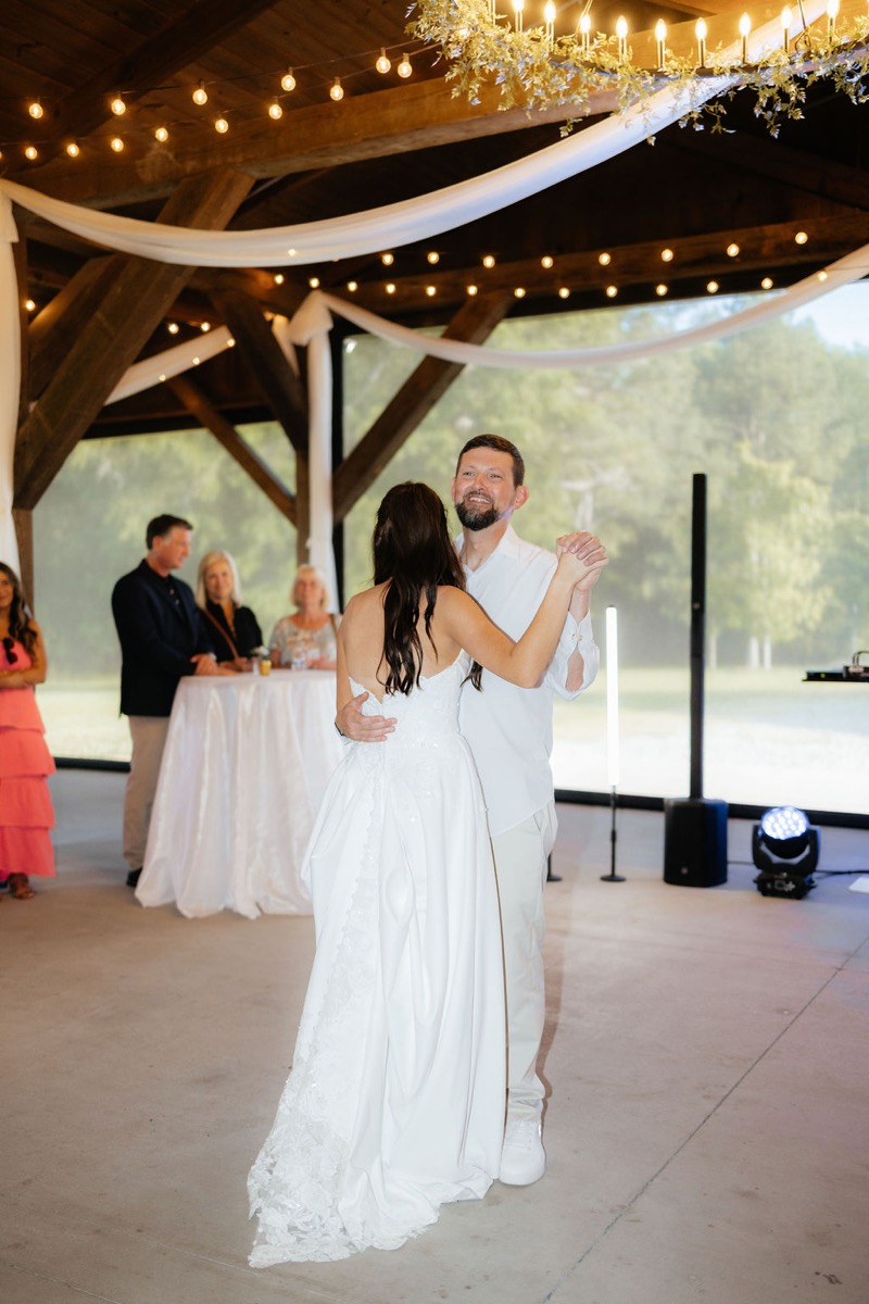 Kylie & Mason reception: Kylie shares a father-daughter dance under string lights at Covey Creek pavilion