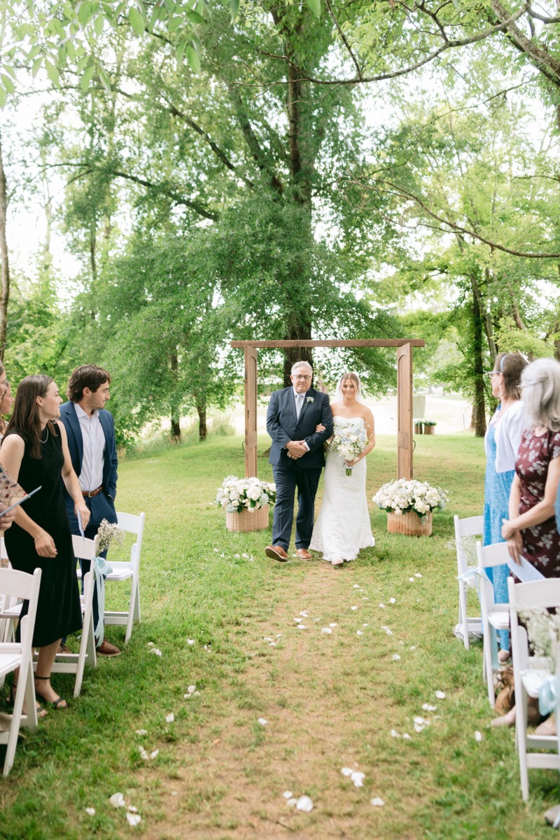 Rachel & Ben's processional as Rachel walks the Tunnel of Love aisle with her father at Covey Creek.